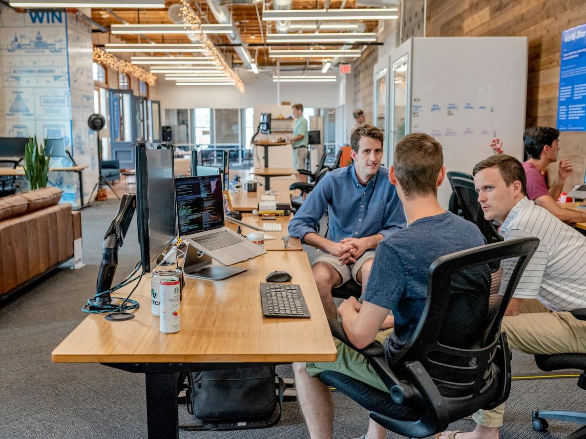 Colleagues collaborating in an open office